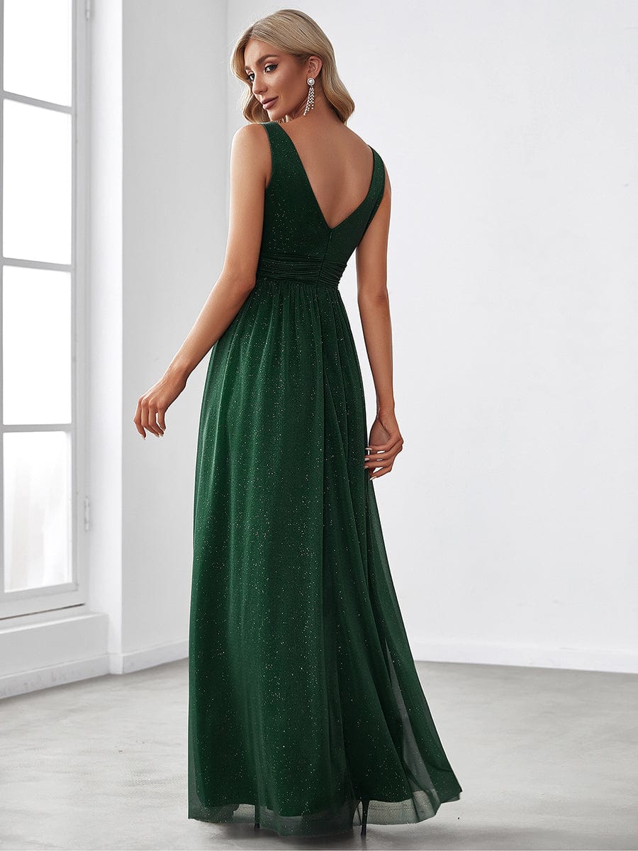 Back view of a dark green sparkly double V-neck floor length evening dress.