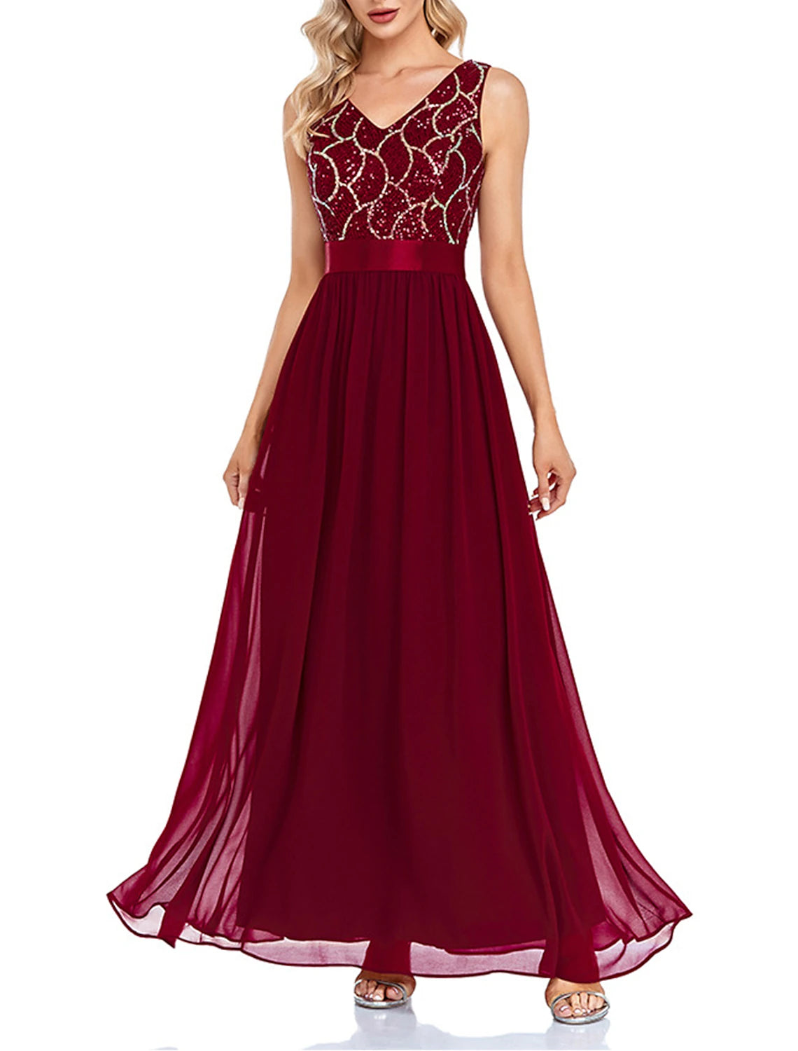 Woman wearing a wine sequin V-neck geometric maxi dress, front view.