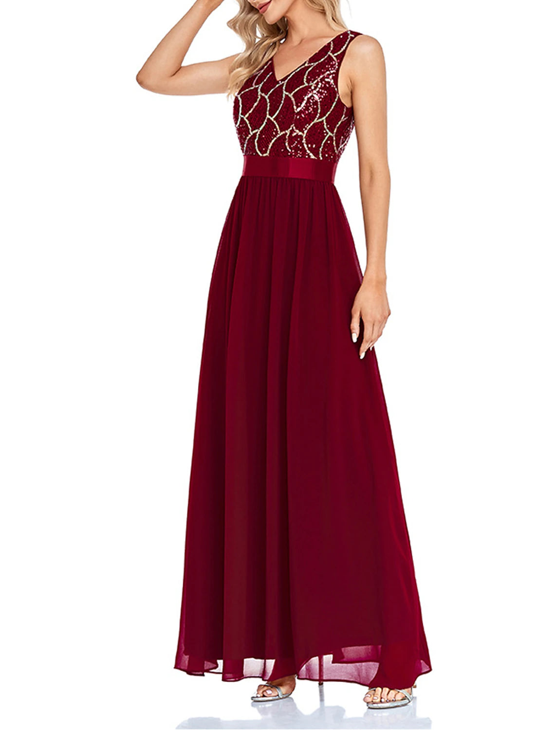 Woman wearing a wine sequin V-neck geometric maxi dress, back view.