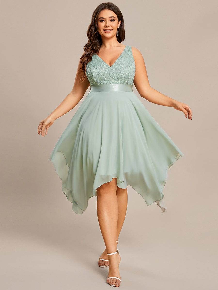Model wearing a dark green plus size V-neck lace prom dress.