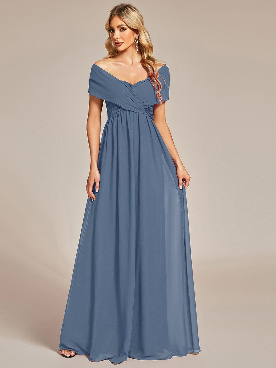 Dark blue convertible chiffon bridesmaid dress styled with delicate cap sleeves.
