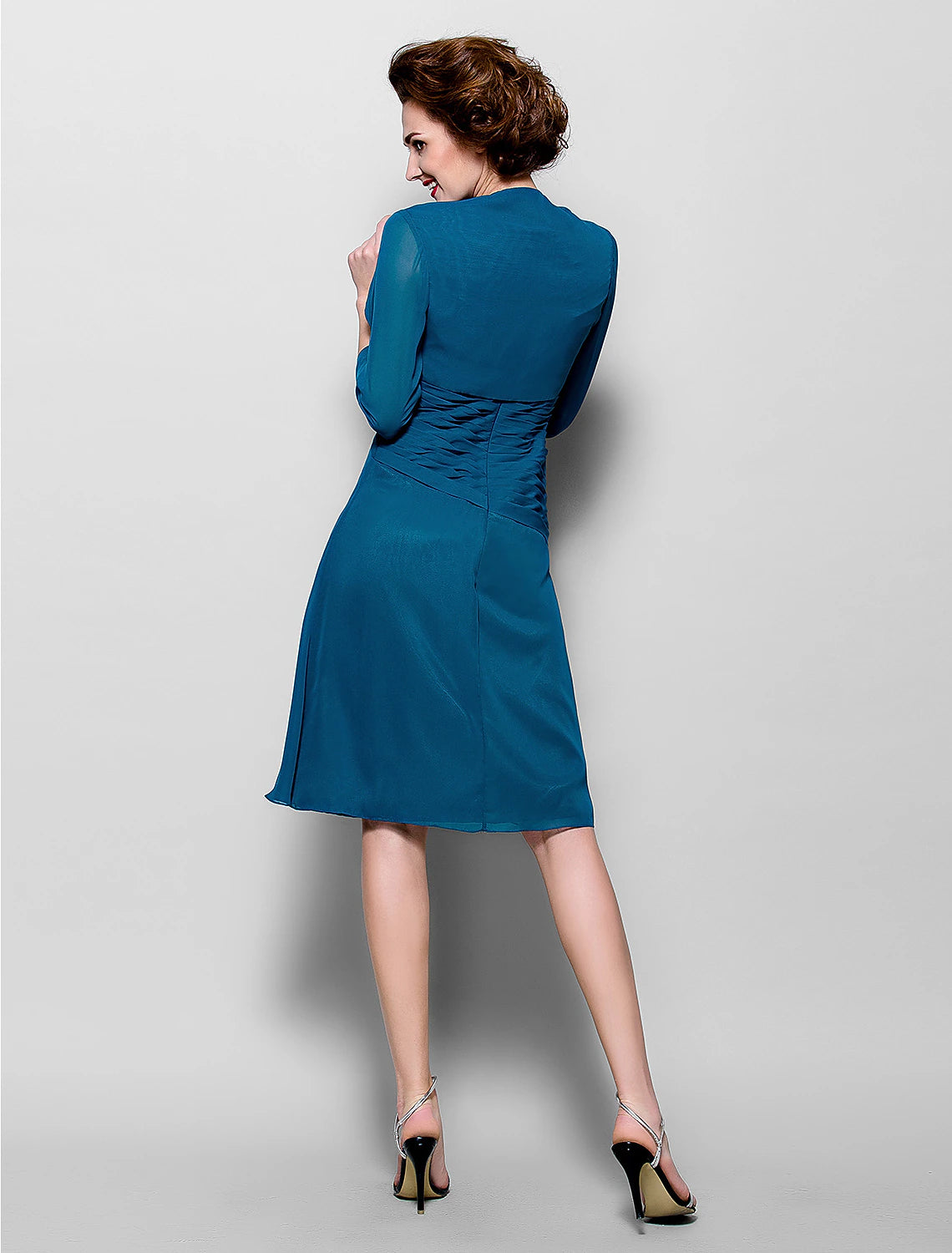 Back view of an A-line chiffon dress with 3/4 sleeves.