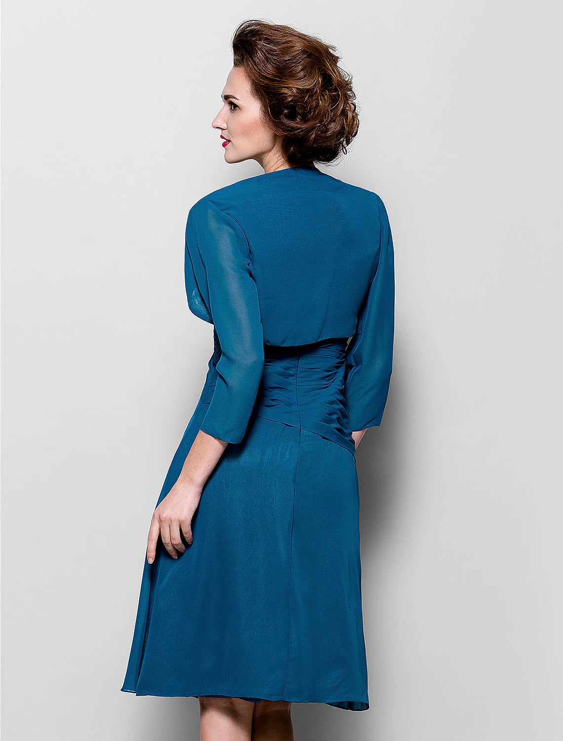 Side view of an A-line V-neck dress showing criss-cross draping.
