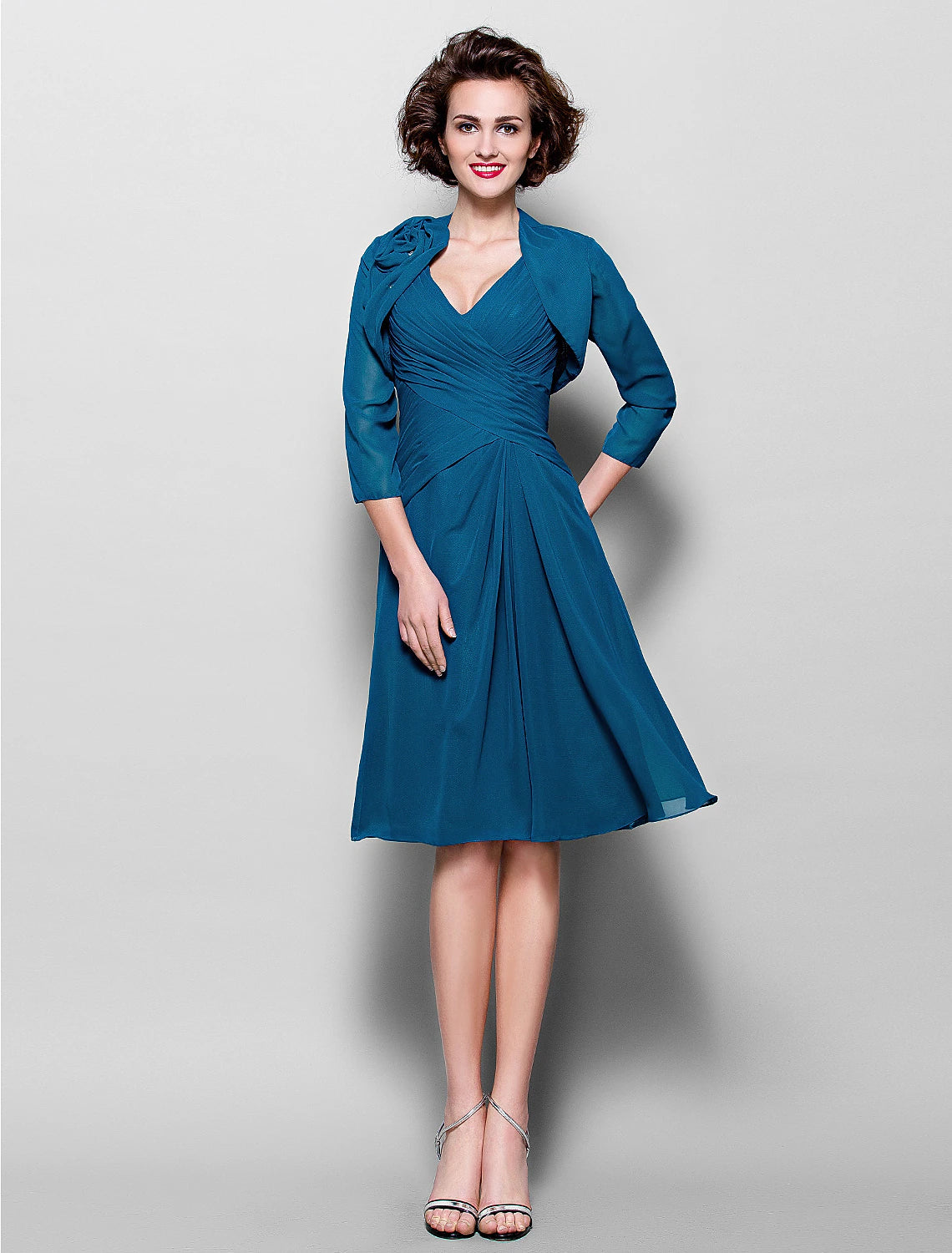 Elegant A-line dress with a wrap and side draping.