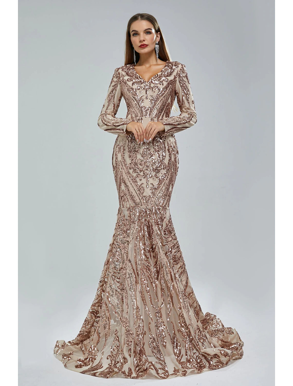 Model wearing a dazzling Weitese mermaid trumpet evening gown with long sleeves and sequin lace.
