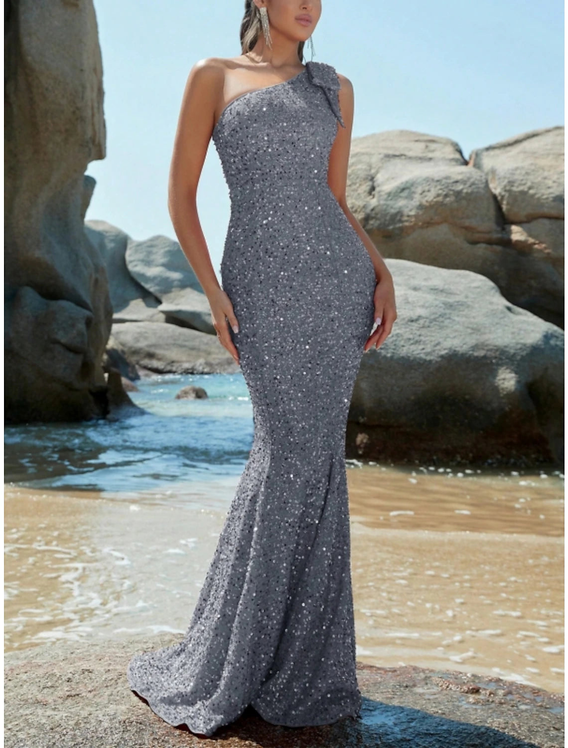 Side view of sequined one-shoulder Weitese formal gown.