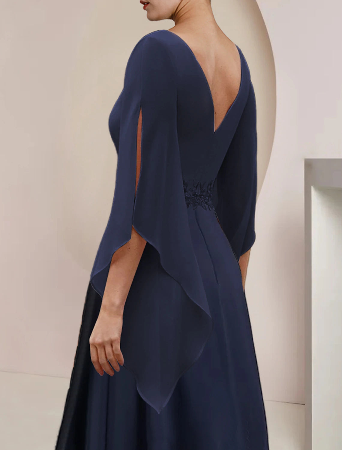 Close-up of the delicate lace and applique on the Weitese dress.