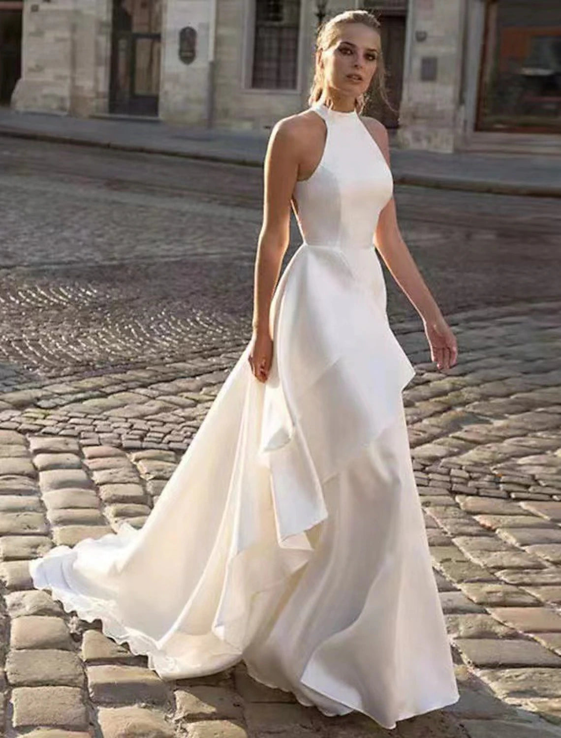 Model wearing Weitese A-Line halter satin wedding dress with court train.