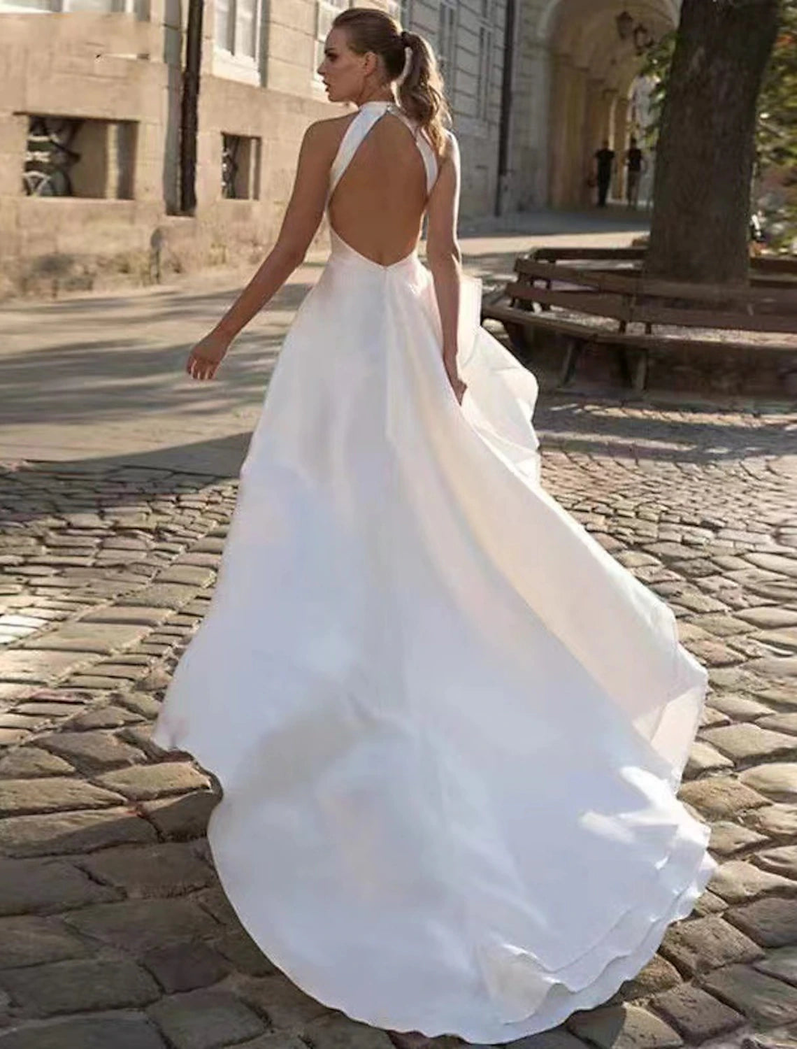 Back view of the Weitese A-Line halter wedding dress, highlighting the open back and court train.