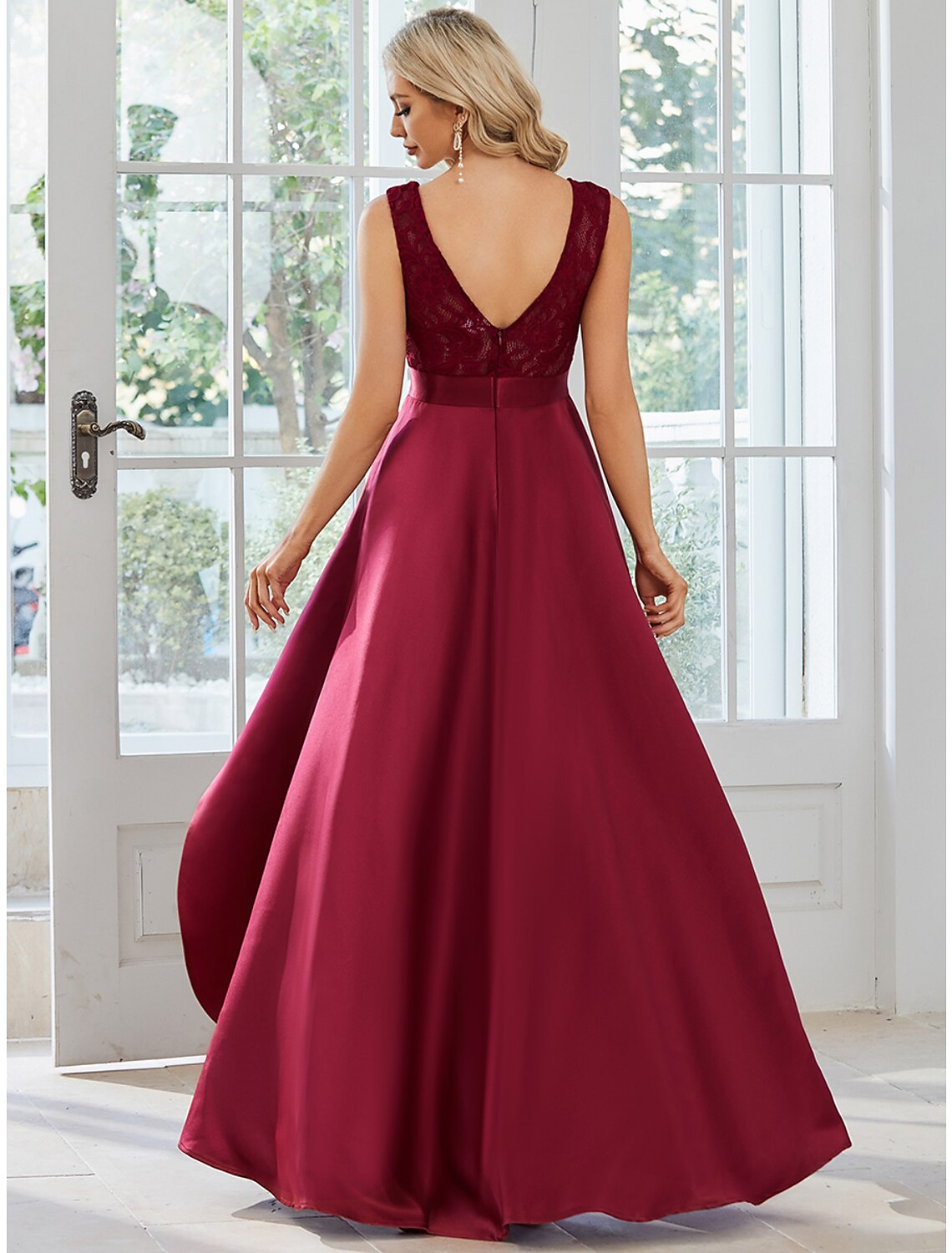 Side view of a woman in the A-line jewel neck satin dress.