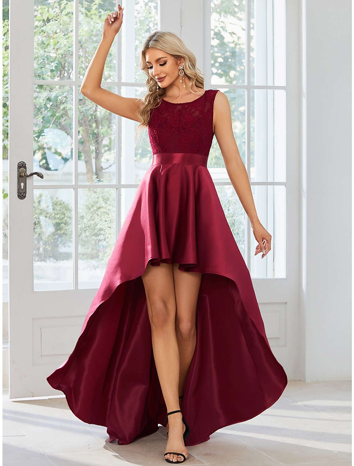 Close-up of the jewel neck and satin fabric of the dress.
