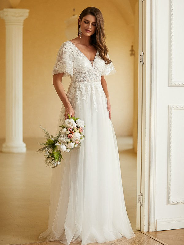Back view of the Weitese wedding dress, showcasing the elegant lace details and floor-length train.