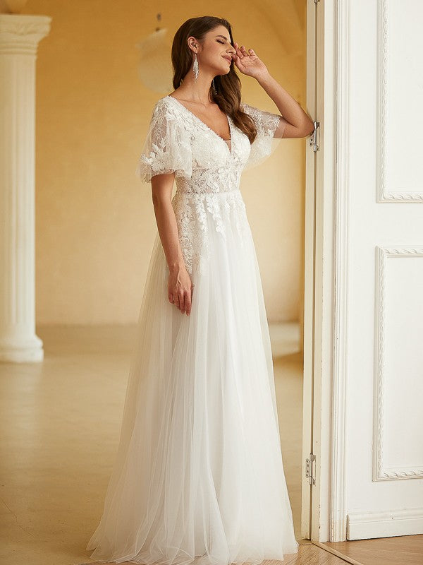 Side profile of the Weitese A-Line Princess wedding dress, highlighting its flowing silhouette.
