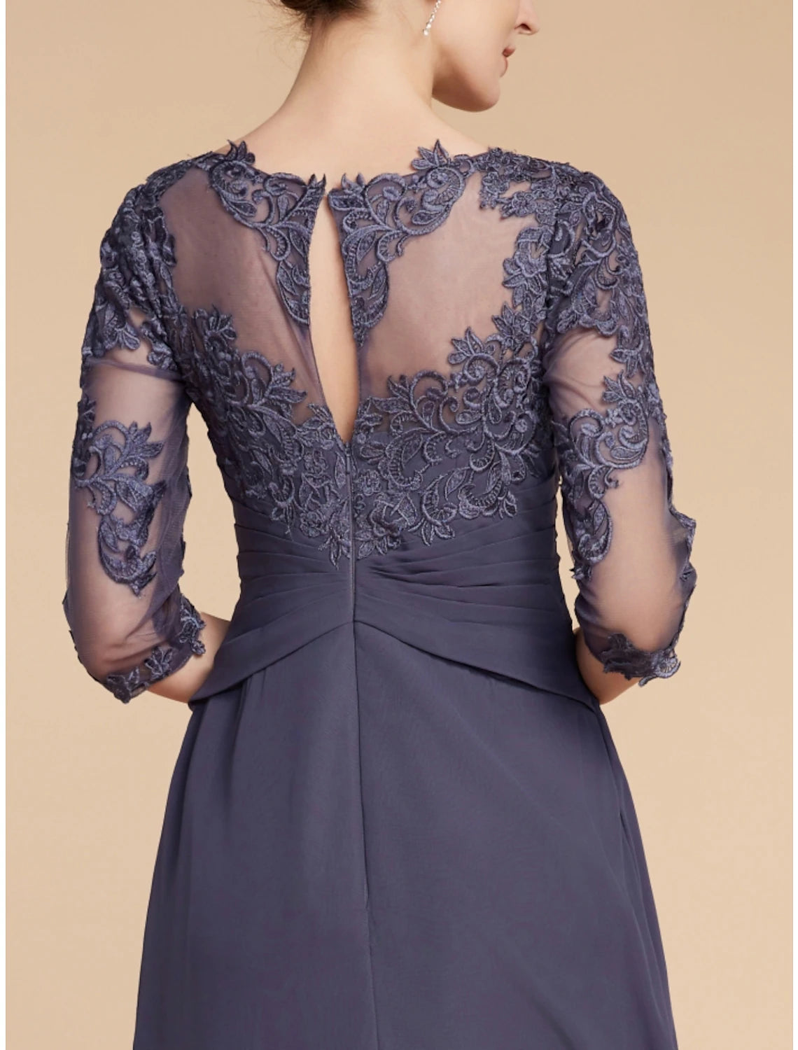 Scoop neck and ruched waist detail of the A-line dress.