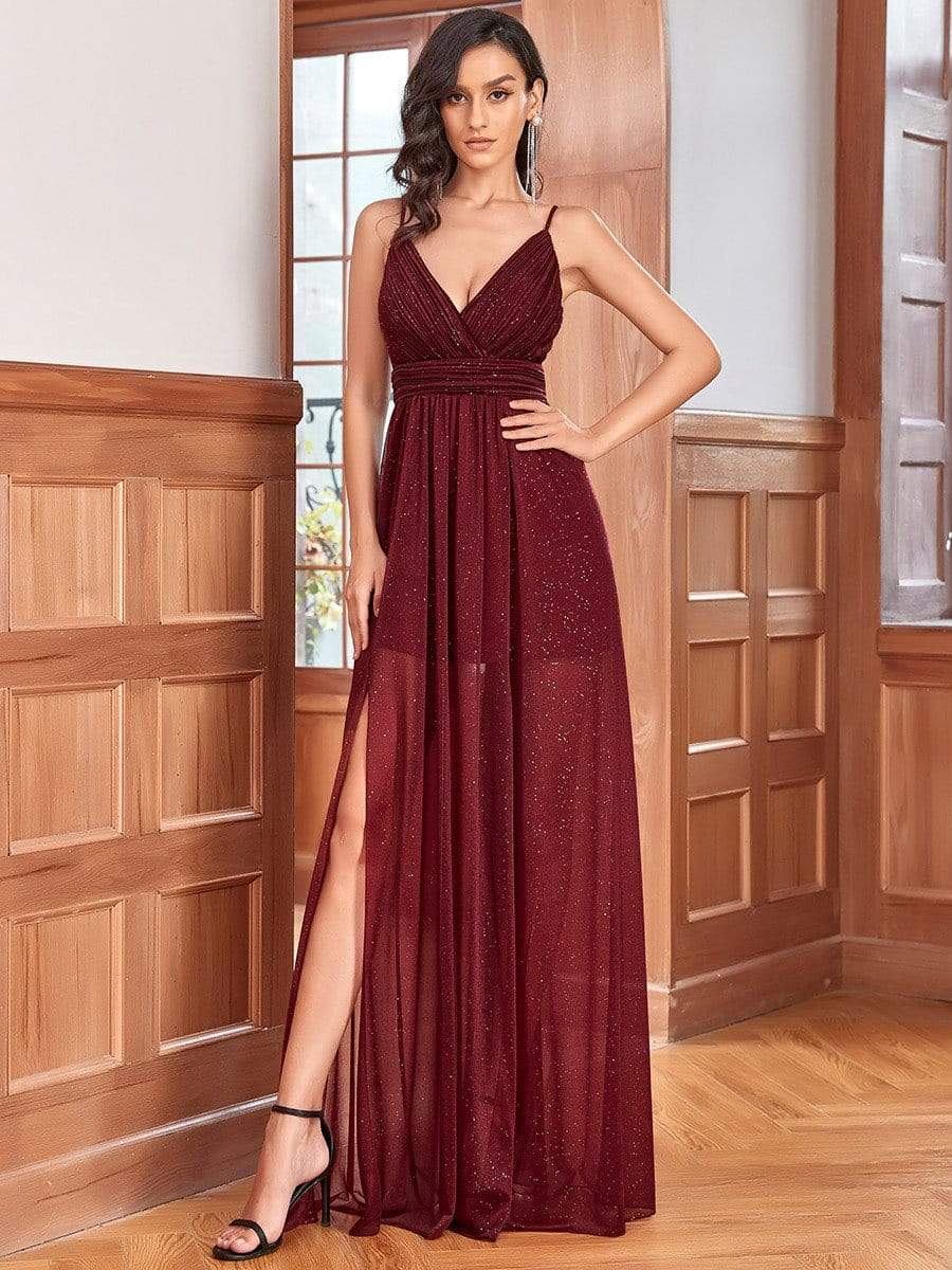 Woman wearing a red Weitese spaghetti strap sheer bridesmaid dress.