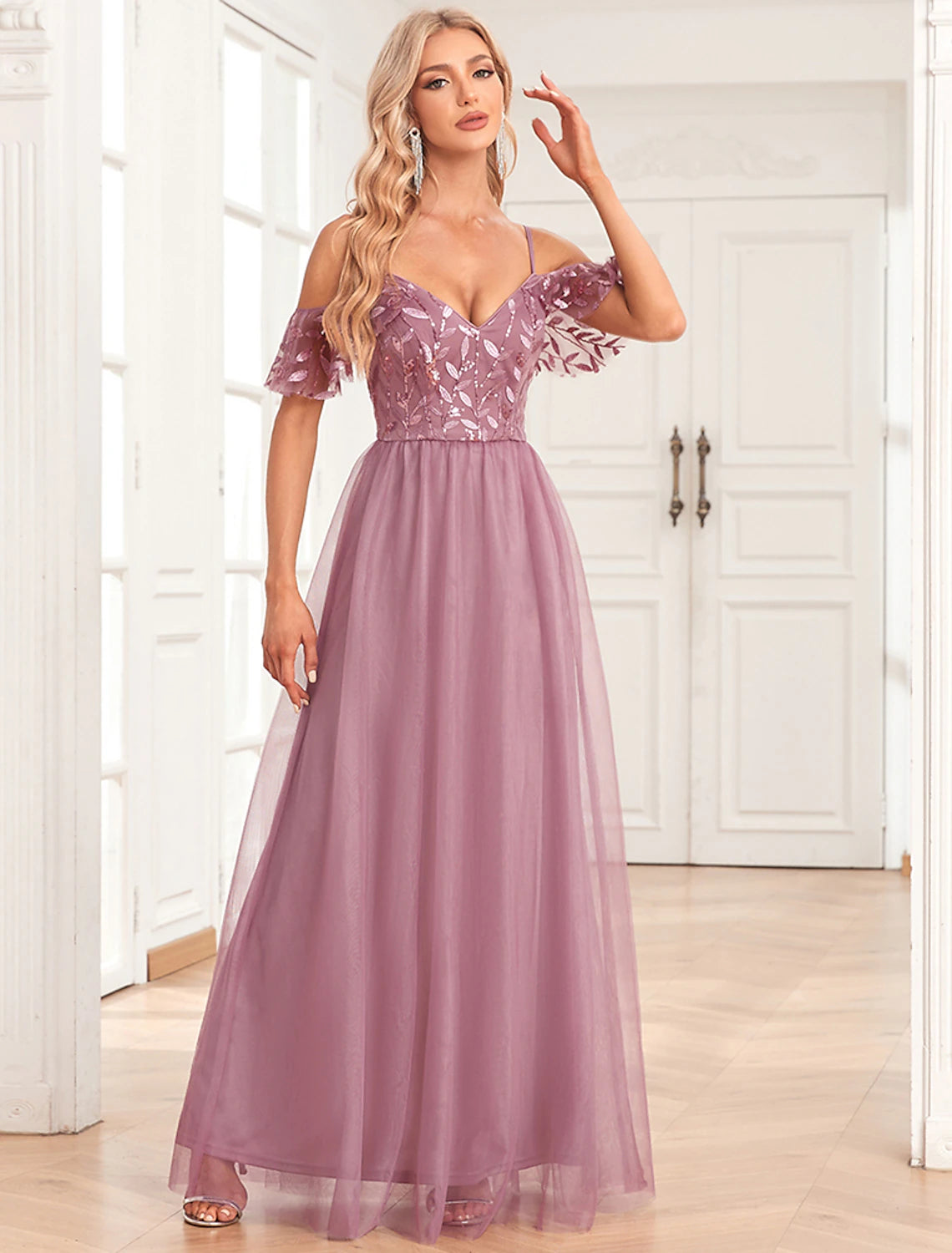 Back view of A-line gown with V-back and spaghetti straps.
