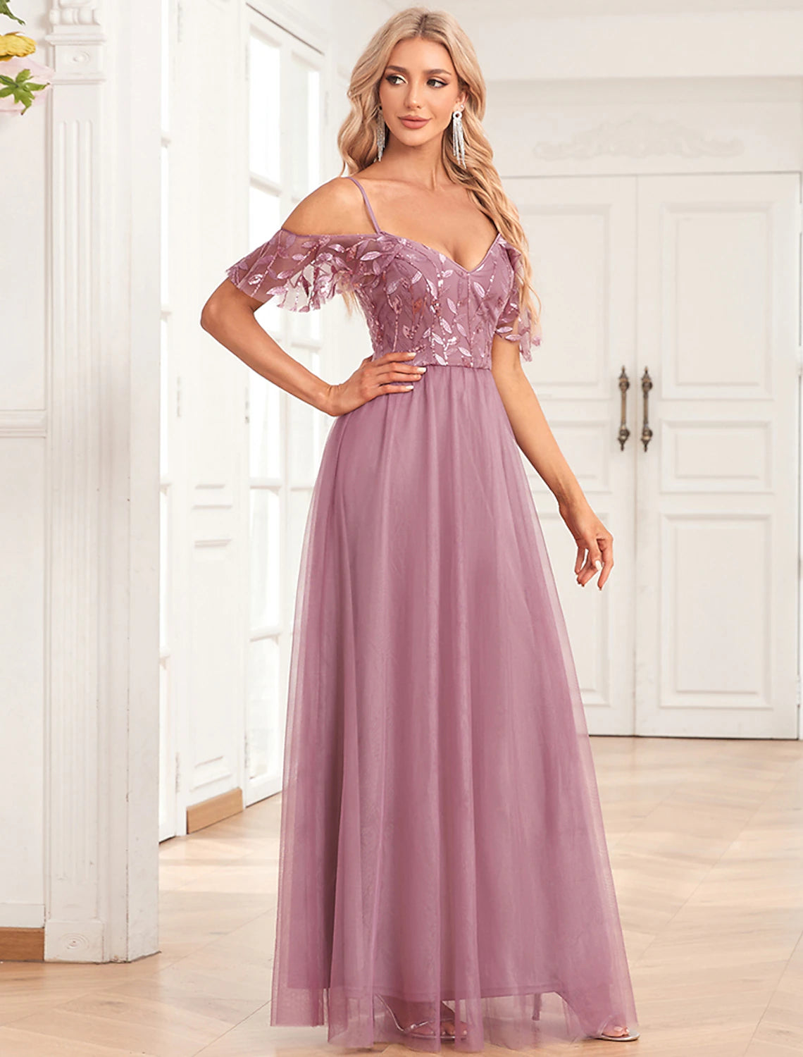 Detail of spaghetti strap and neckline on the gown.