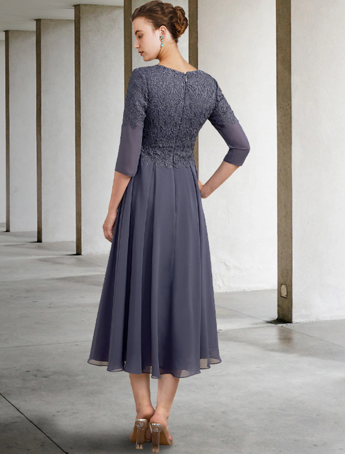 Side view of the A-line chiffon lace dress with ruffles and appliques.
