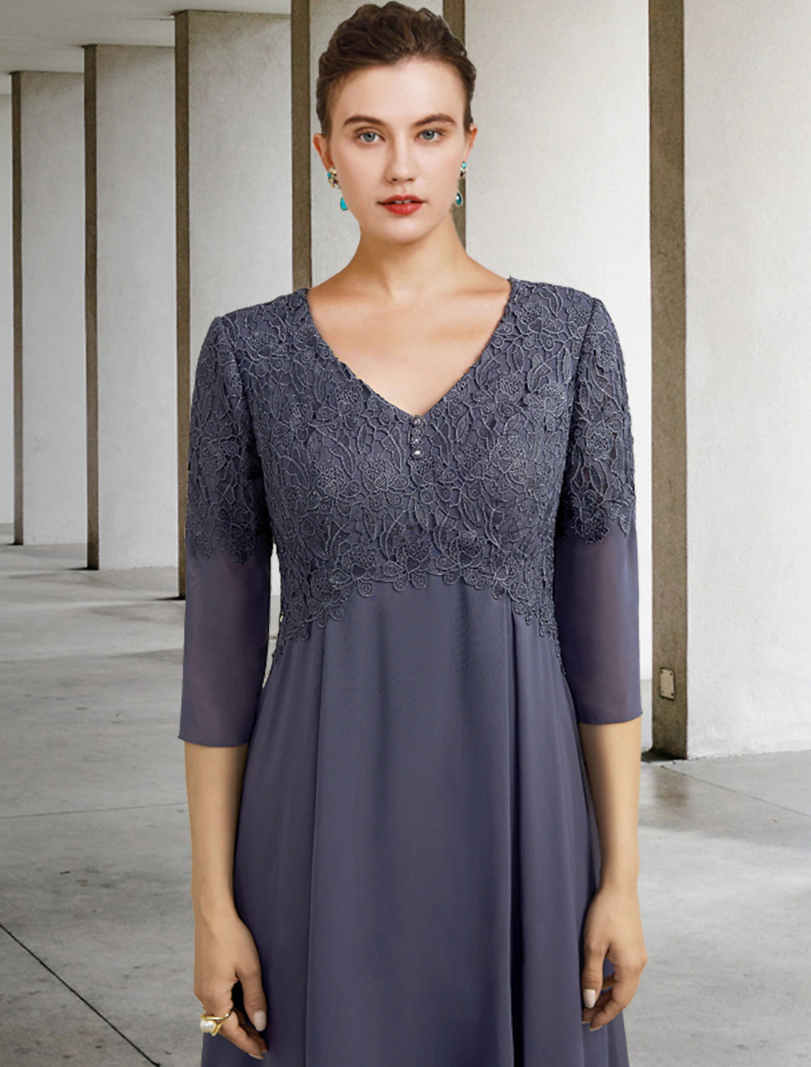Close-up of chiffon lace fabric with ruffles and appliques on the dress.