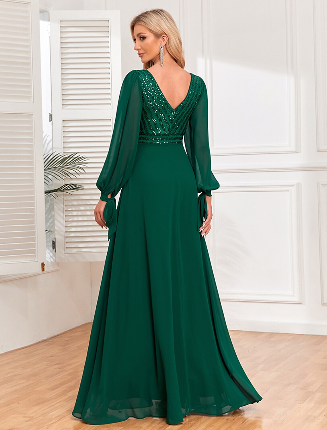 Back view of the Weitese A-line V-neck long sleeve sequin chiffon evening gown.