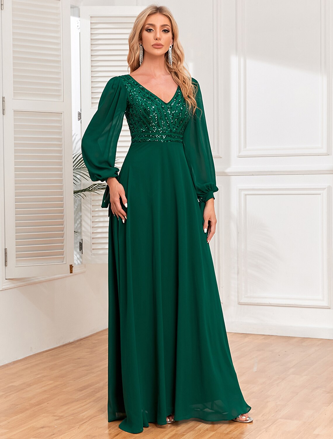 Woman posing gracefully in the Weitese A-line V-neck long sleeve evening gown.