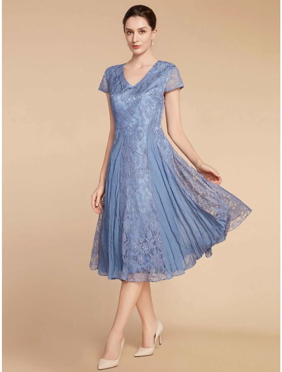 A woman wearing the Weitese A-line V-neck short sleeve knee-length dress.