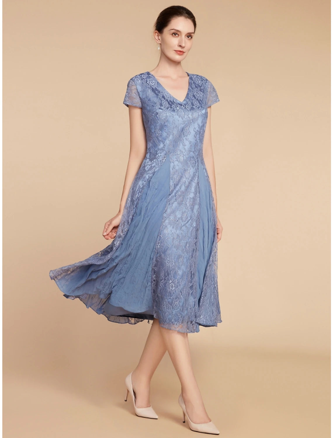 A woman in the Weitese elegant knee-length dress, highlighting the V-neck and short sleeves.