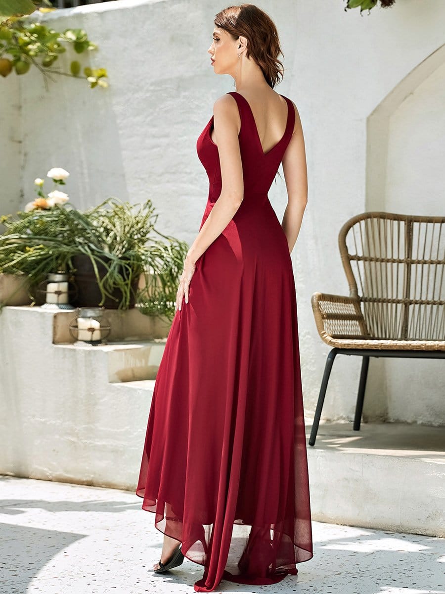 Model wearing a red Weitese V-neck high-low chiffon evening dress, side view.