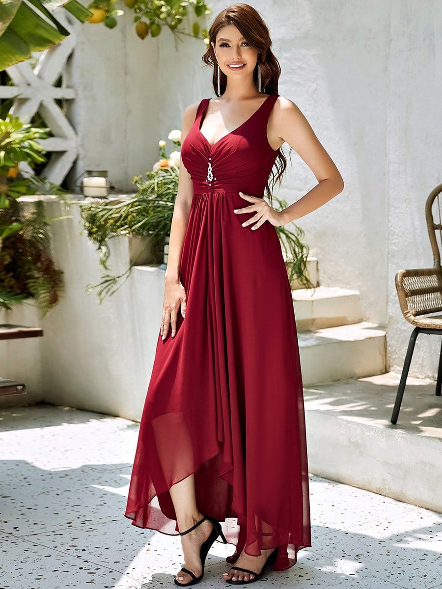 Close-up of the V-neckline and bodice of a red chiffon evening dress.