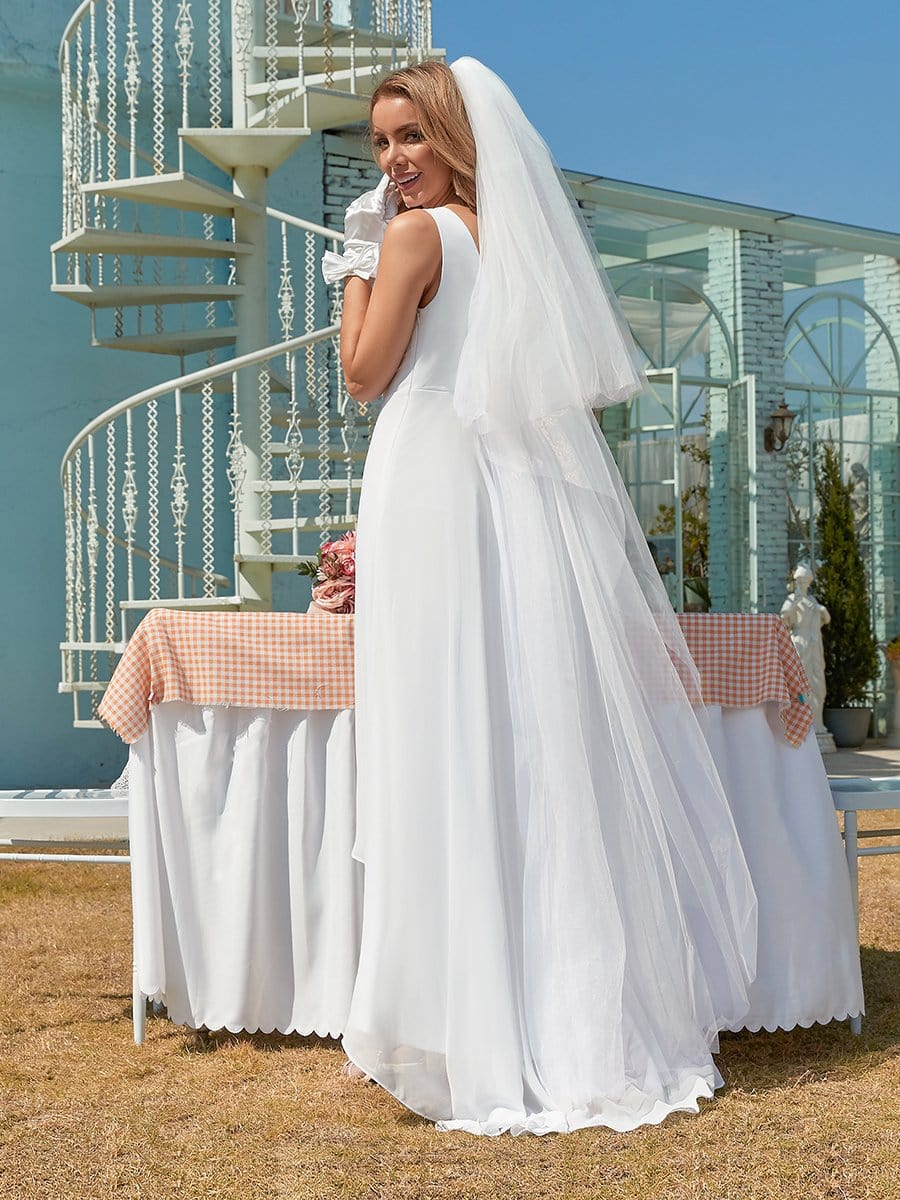 Model wearing a white Weitese V-neck high-low chiffon evening dress, side view.