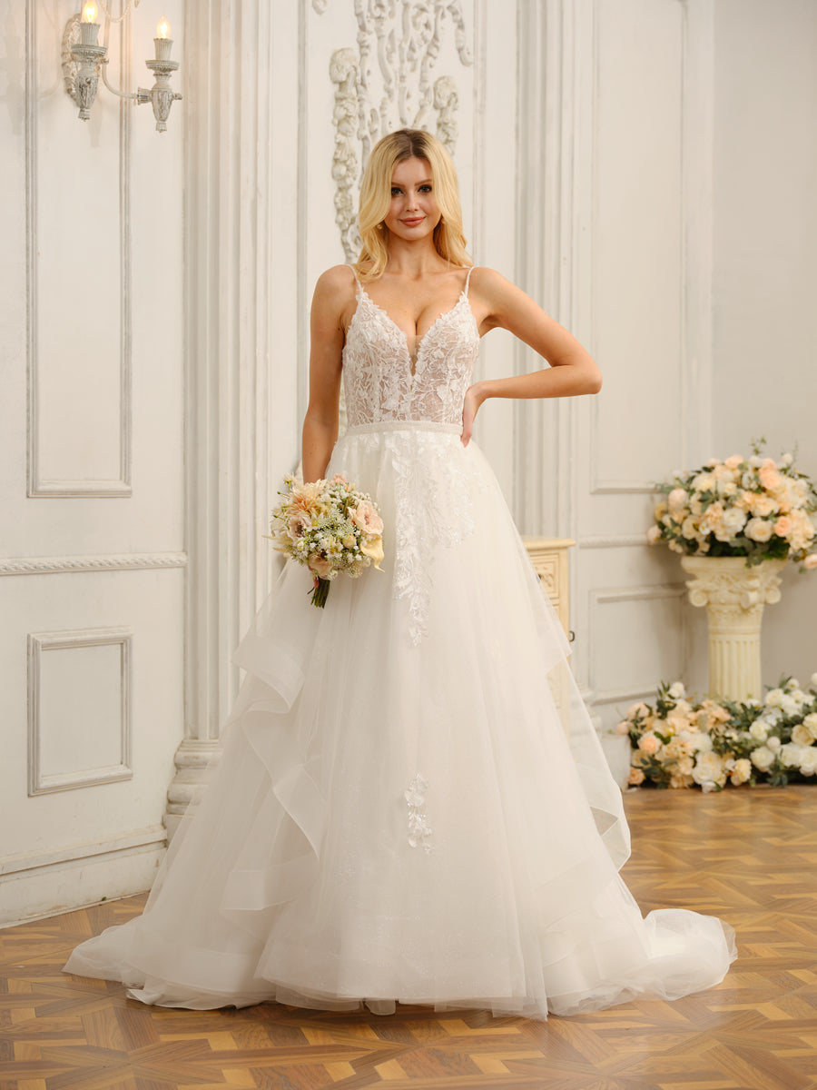 Back view of the Weitese bridal gown, showing the delicate spaghetti straps and train.