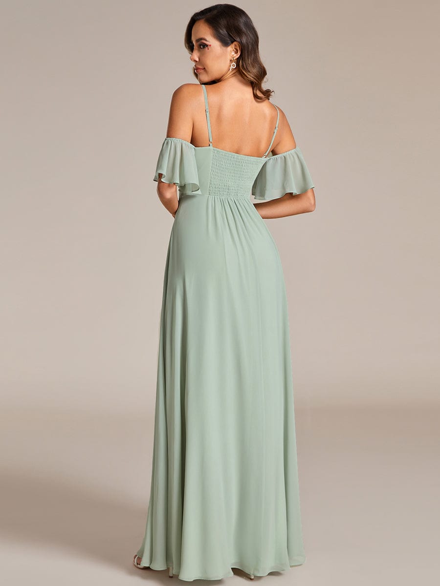 Back view of a model wearing a green Weitese A-line chiffon bridesmaid dress.