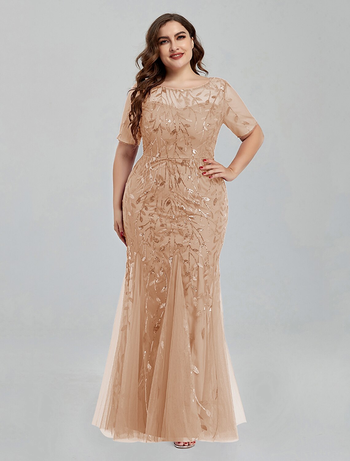 Full length view of a woman posing in the Weitese short sleeve jewel neck gown.