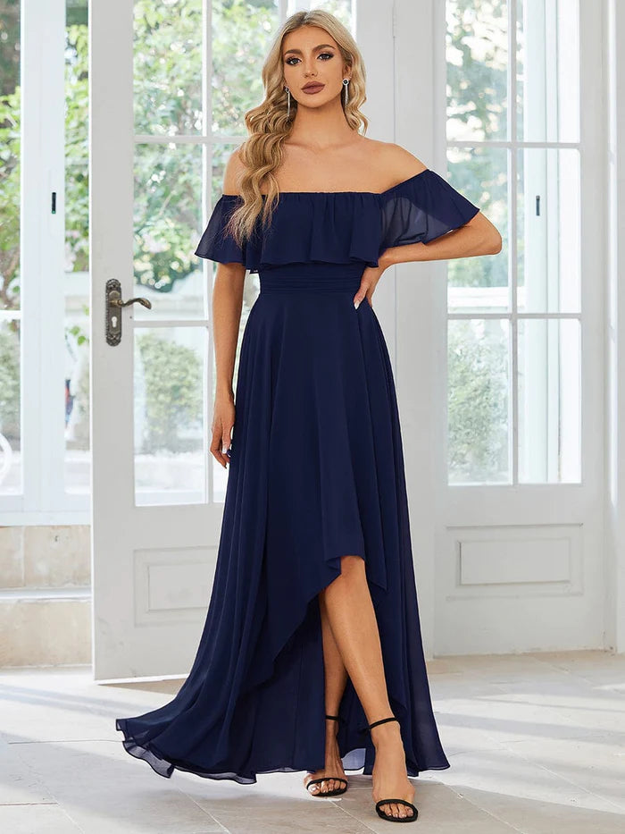 Woman seated in the comfortable off-shoulder chiffon bridesmaid dress.