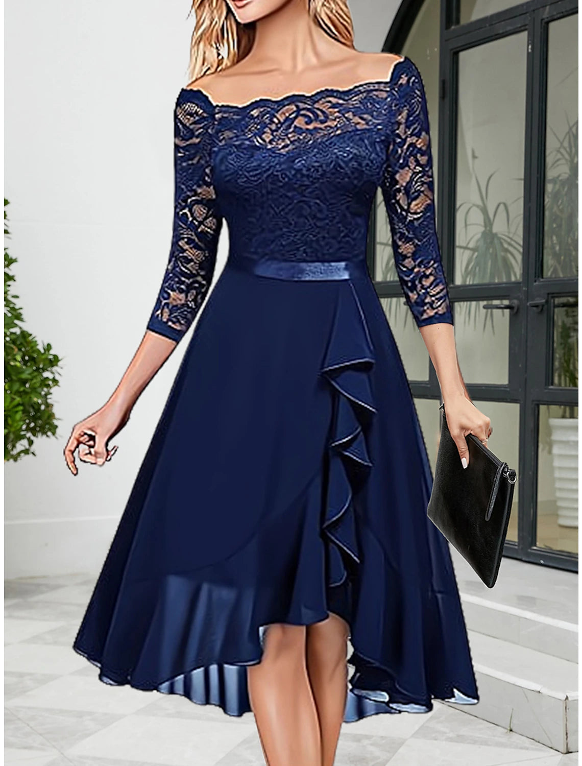 Woman wearing a dark blue Weitese elegant lace midi dress with half sleeves and a crew neck.