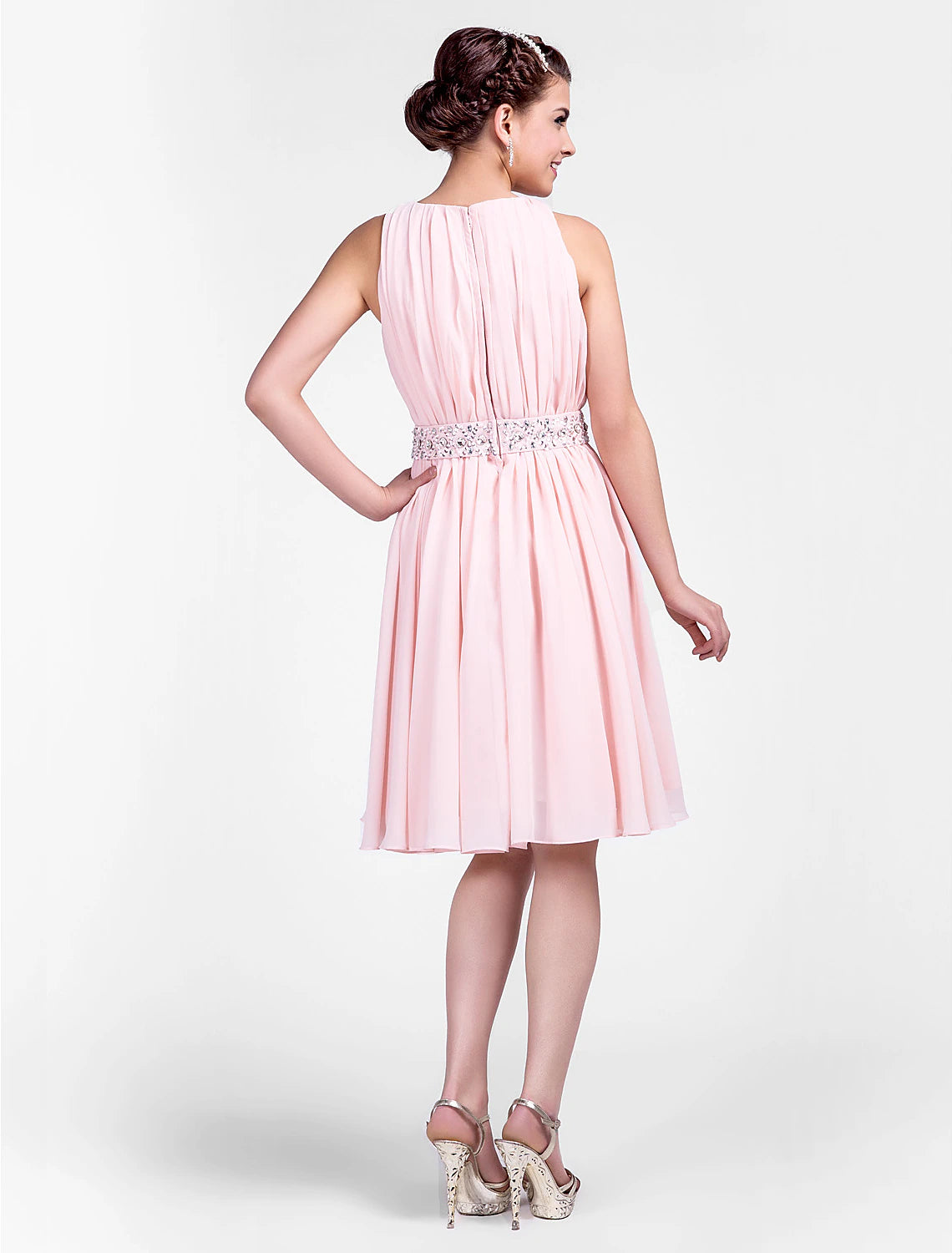 Side view of the jewel neck sleeveless knee-length chiffon dress, highlighting the draping.
