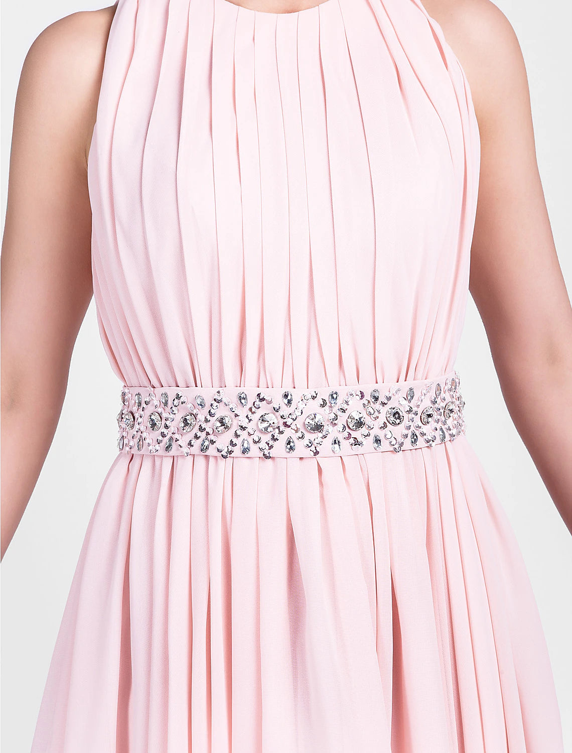 Model posing in the jewel neck sleeveless knee-length chiffon dress, showcasing its flow.