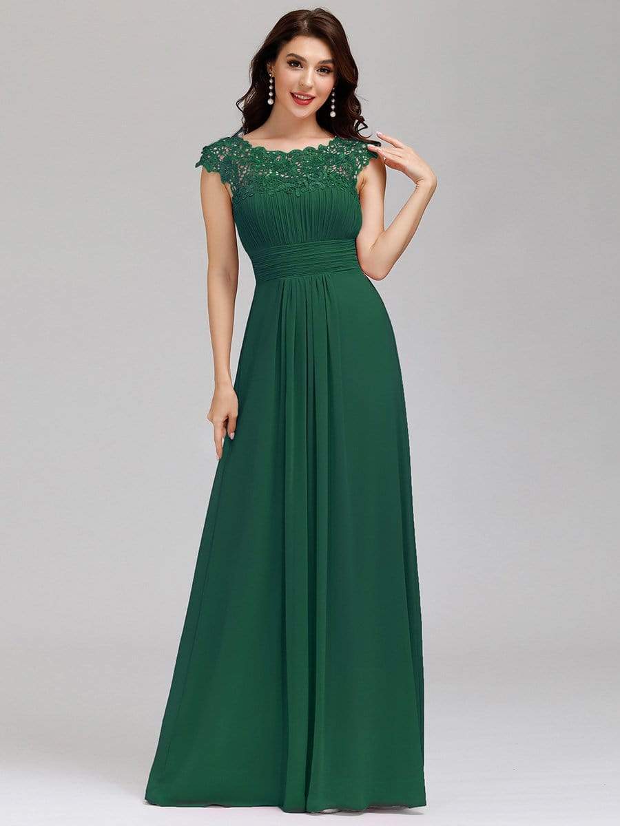 Bridesmaid dress in a darker shade, showcasing the lace cap sleeve design.