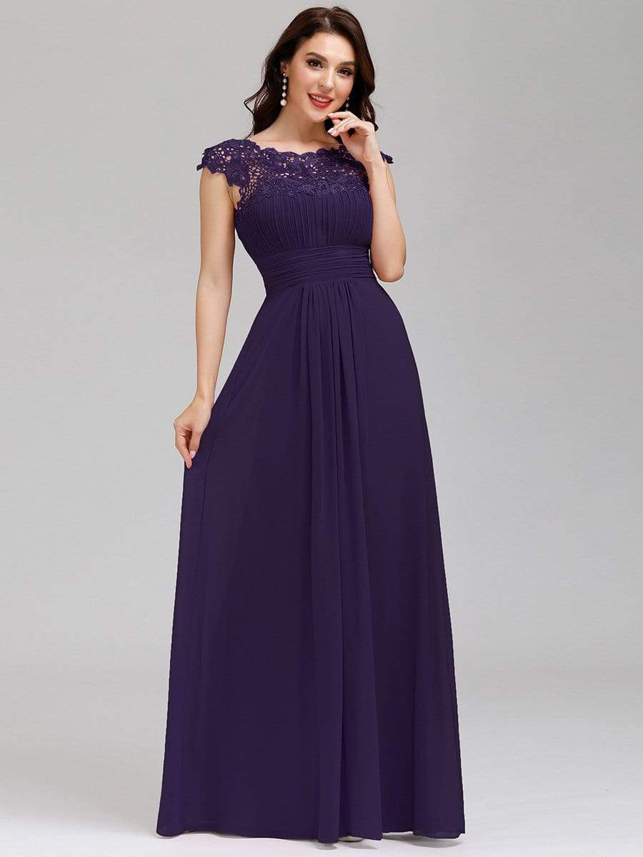 Chiffon maxi dress with delicate lace cap sleeves in a vibrant color.