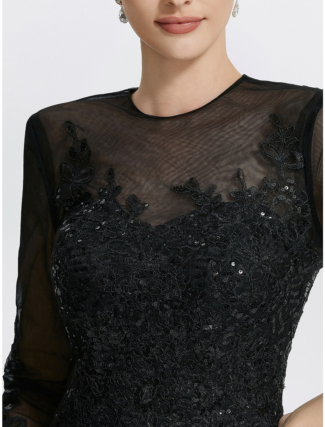 Back view of the Weitese formal gown, highlighting the intricate lace and appliques.