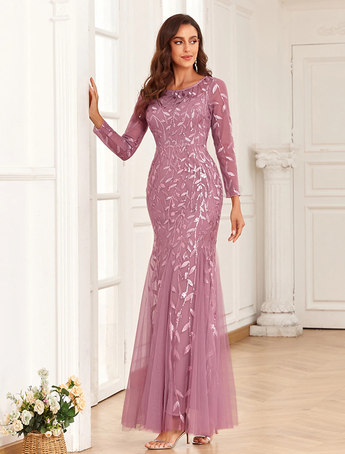 Full-length view of the elegant mermaid evening gown, highlighting its silhouette.