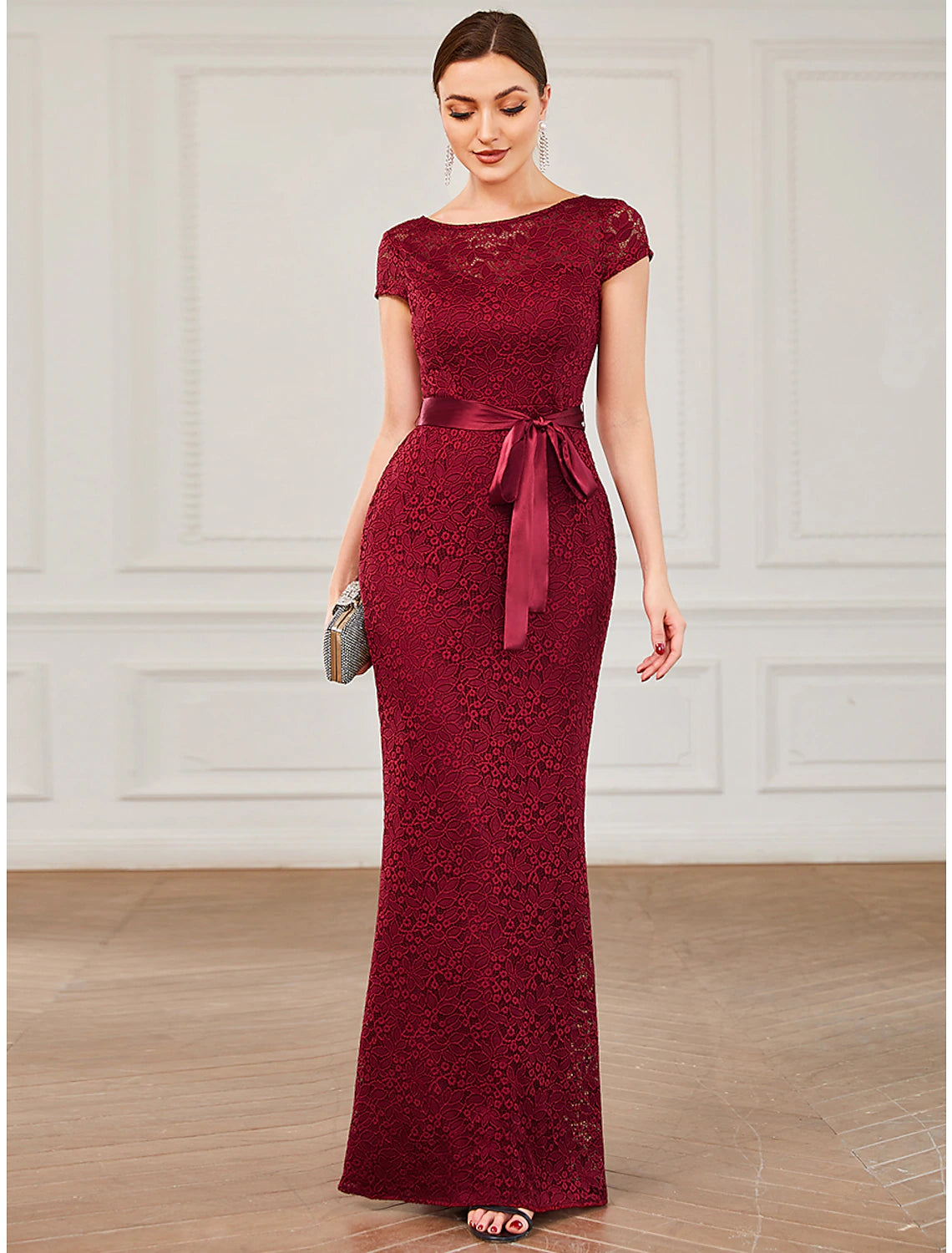 Close-up of the Weitese evening gown's jewel neck and short sleeve detail.
