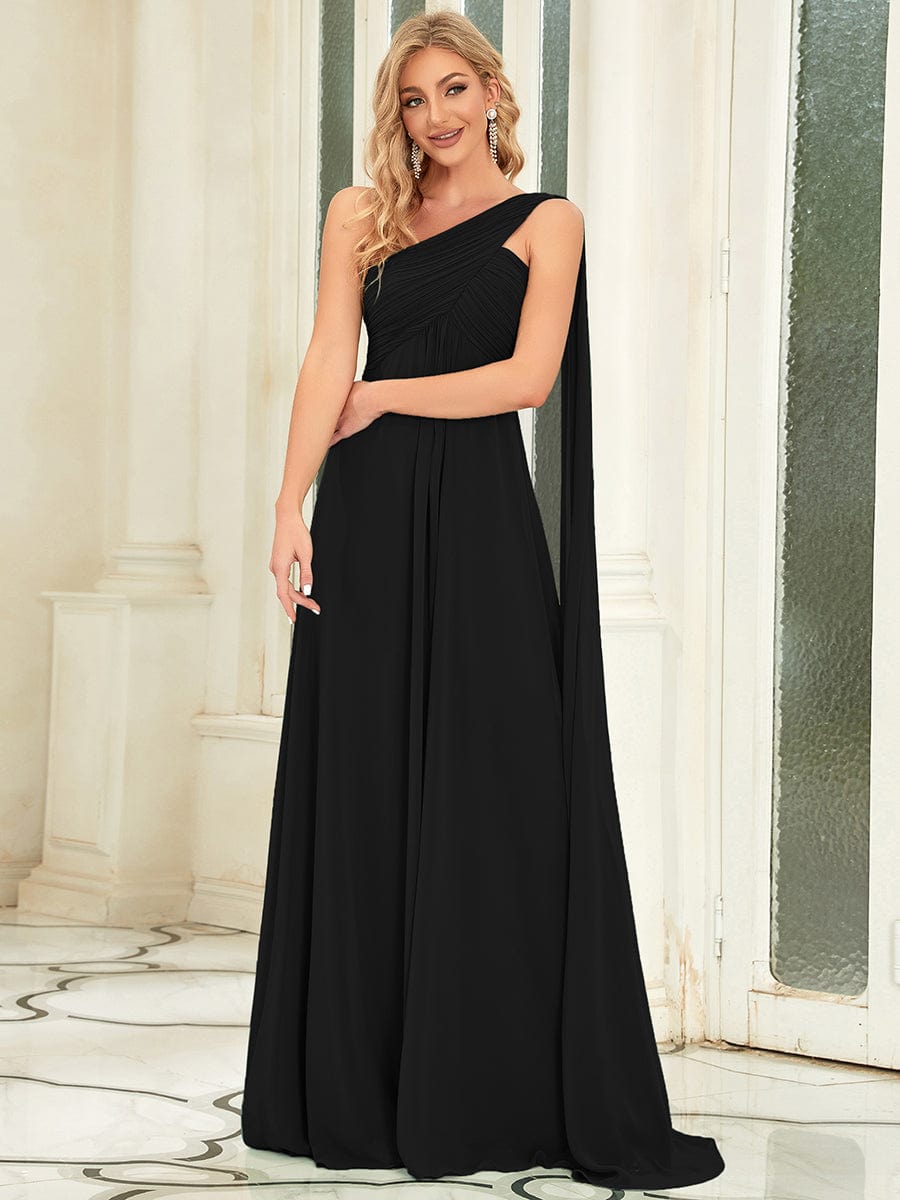 Model posing in a black Weitese long one-shoulder formal dress.