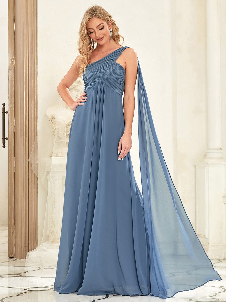 Model wearing a dark blue Weitese pleated one-shoulder long chiffon evening dress.