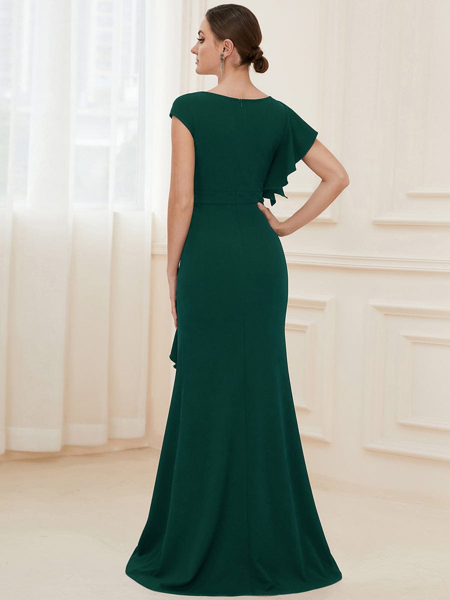 Dark green ruffled asymmetrical knit evening dress, back view.