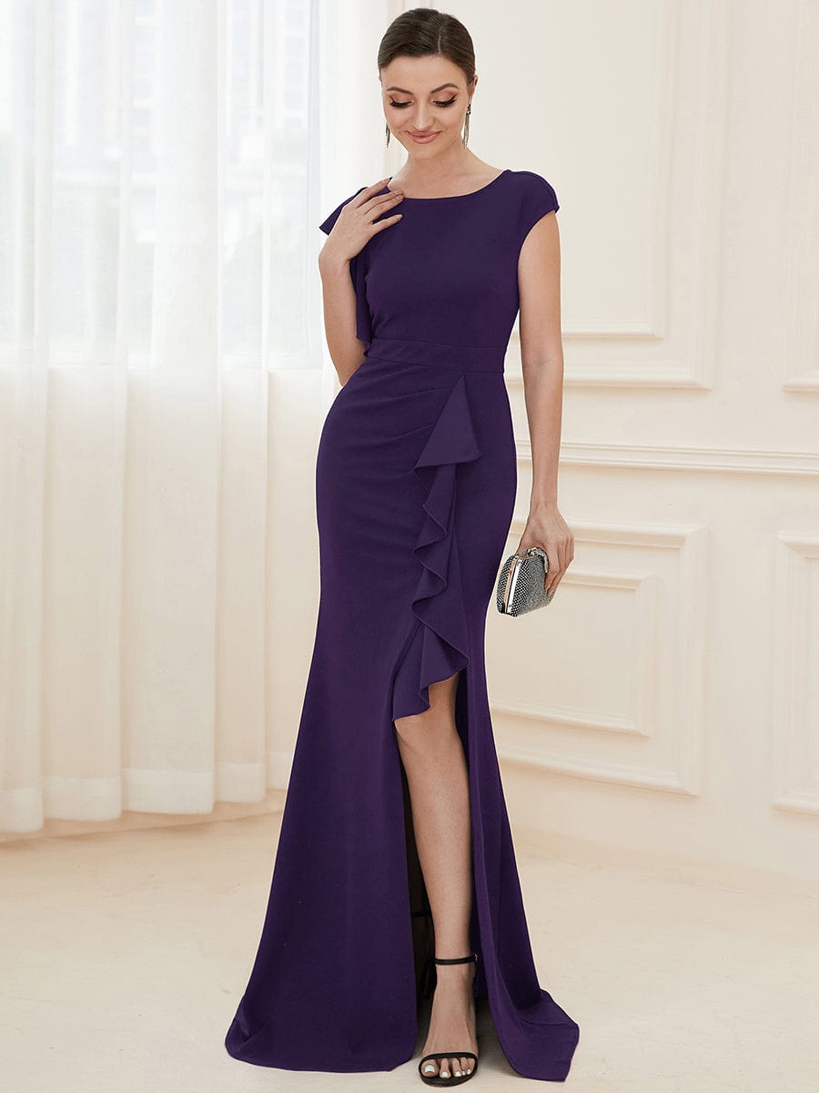 Dark purple ruffled asymmetrical knit evening dress, full length, front view.
