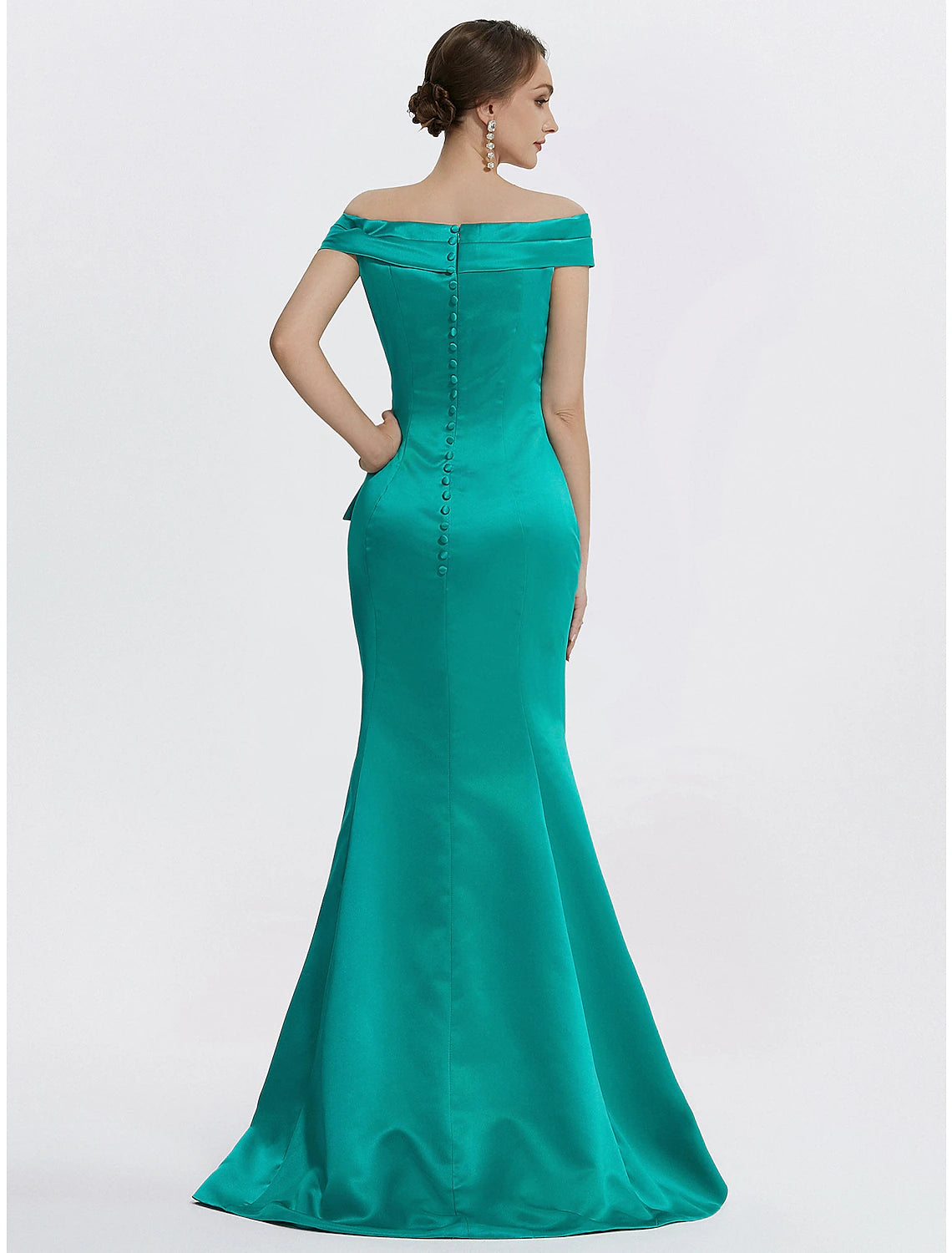 Back view of woman in floor-length satin formal dress.