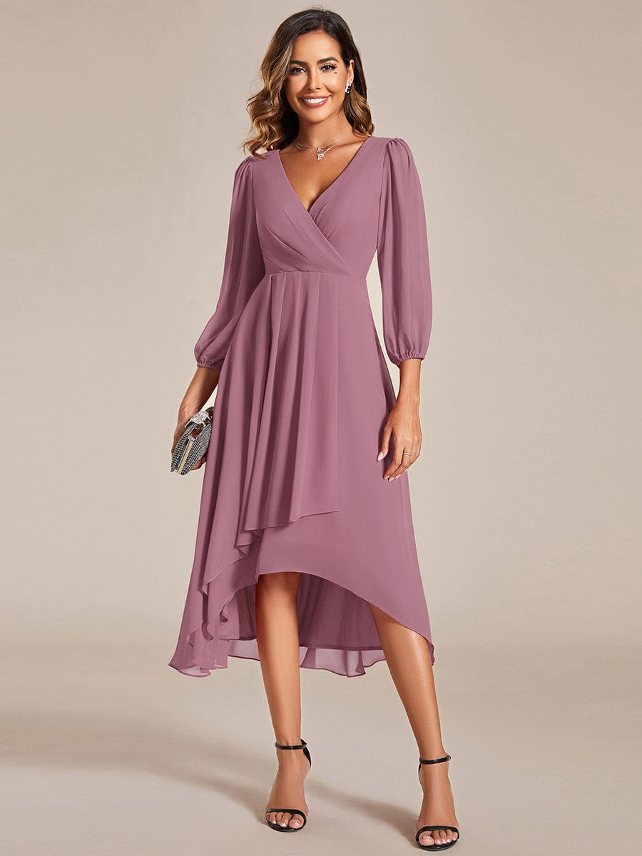 Model wearing an olive green Weitese A-line chiffon wedding guest dress with long see-through sleeves and V-neck.