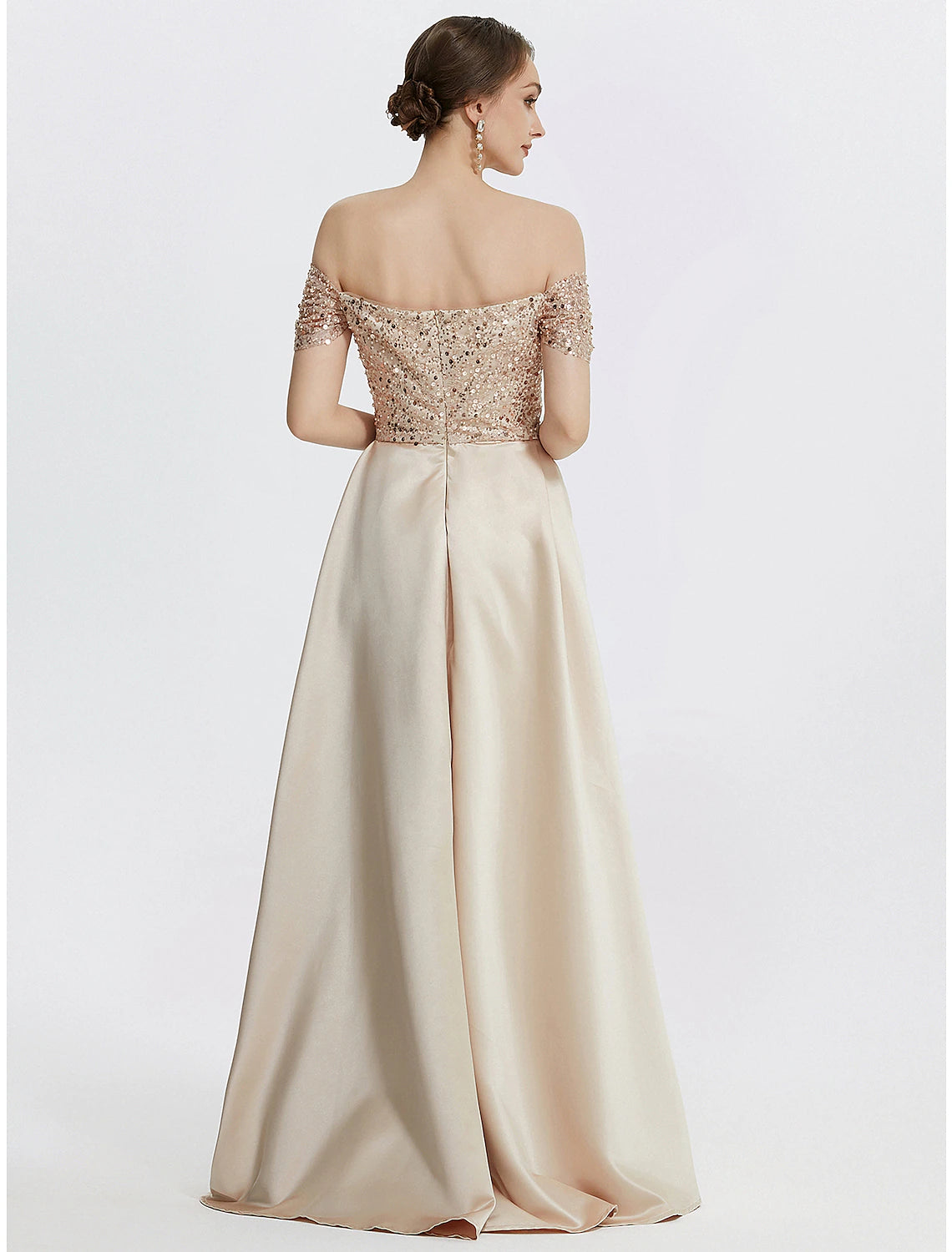 Side view of the Weitese sequined evening gown, showing the thigh-high slit and pleats.