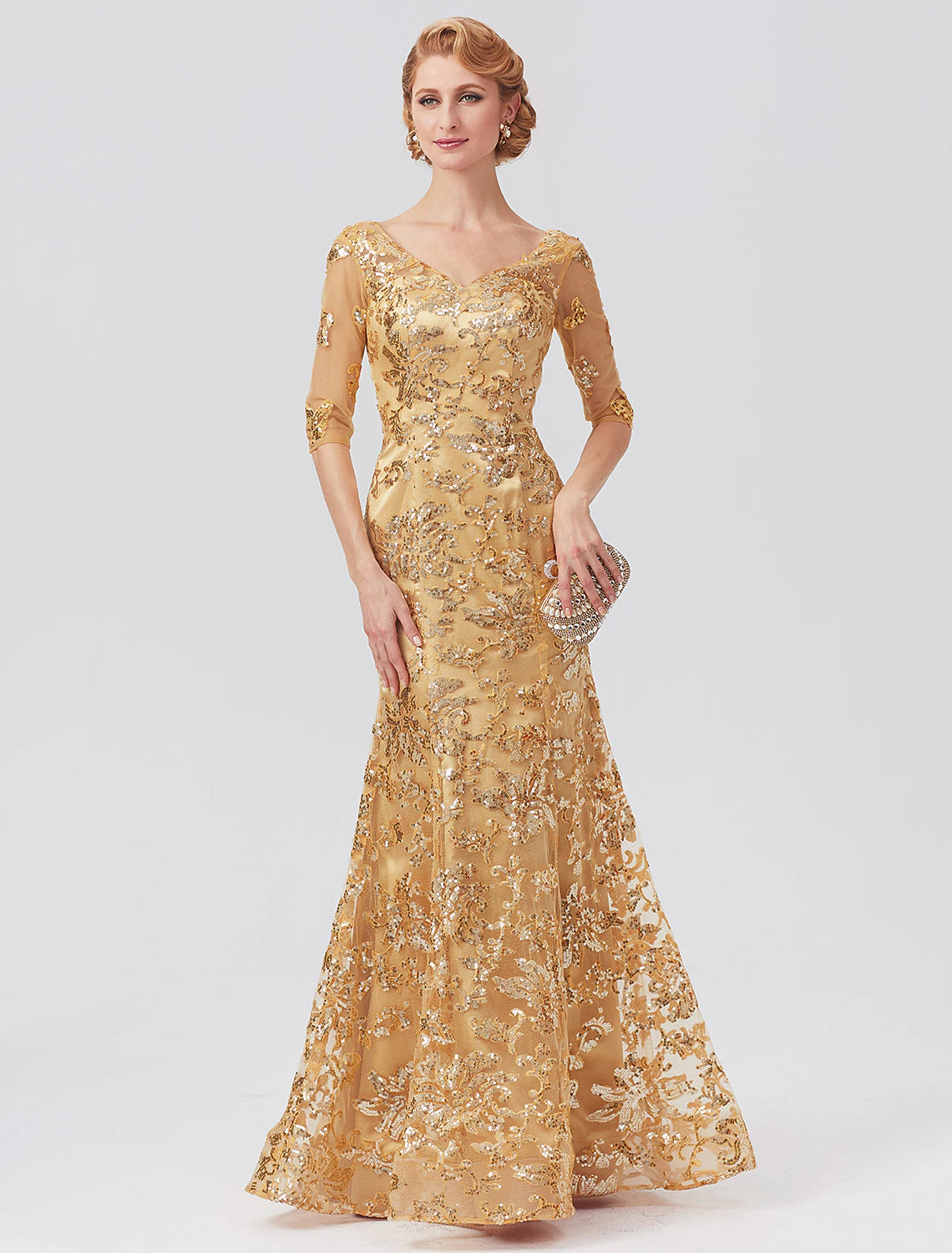 Model wearing a sparkling sequined mermaid mother of the bride dress with V-neck and half sleeves.